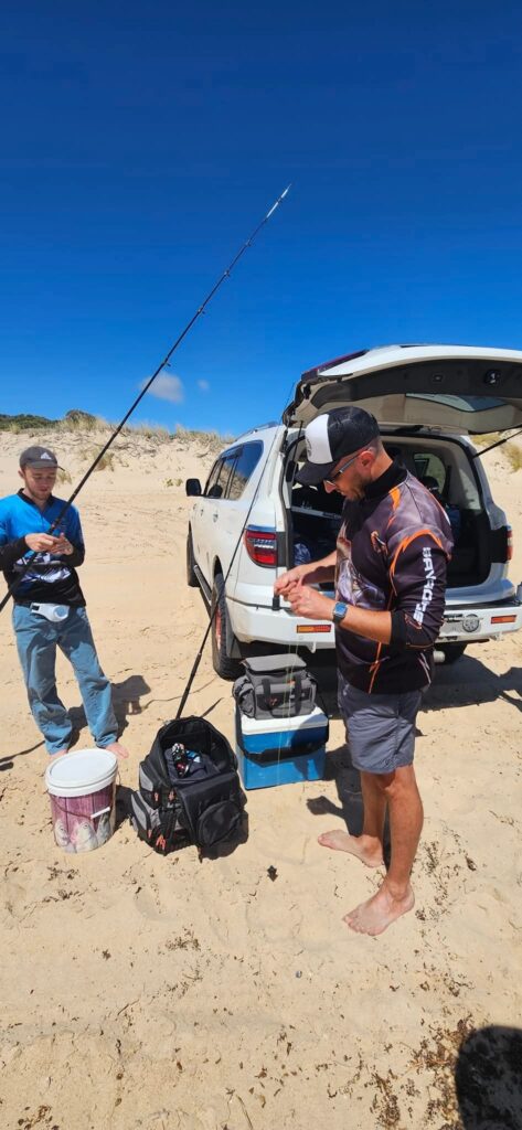 OutAbout Oz - 2 men with fishing rods on the beach