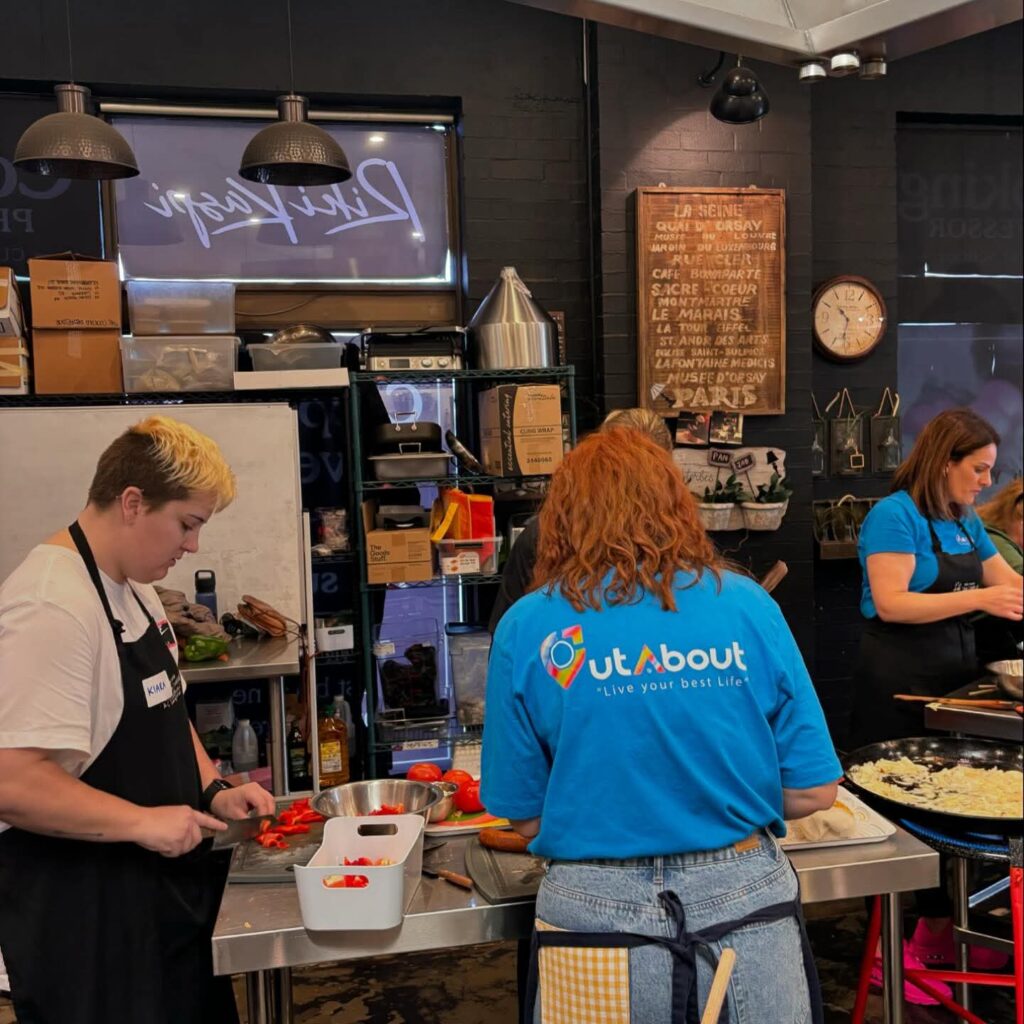 OutAbout Oz team prepping a meal in the kitchen