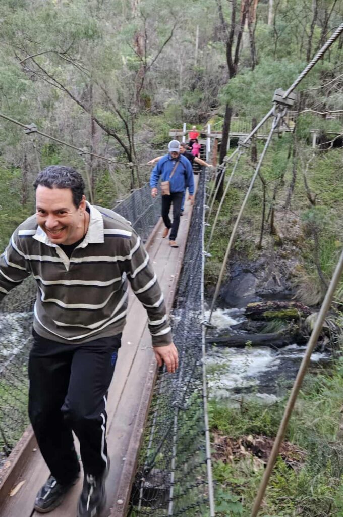 Monthly Adventure Programs: OutAbout Oz Programs - Men walking across high suspension bridge over water